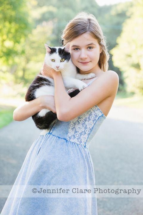 Portrait of a girl and her cat in an Ashbourne village.