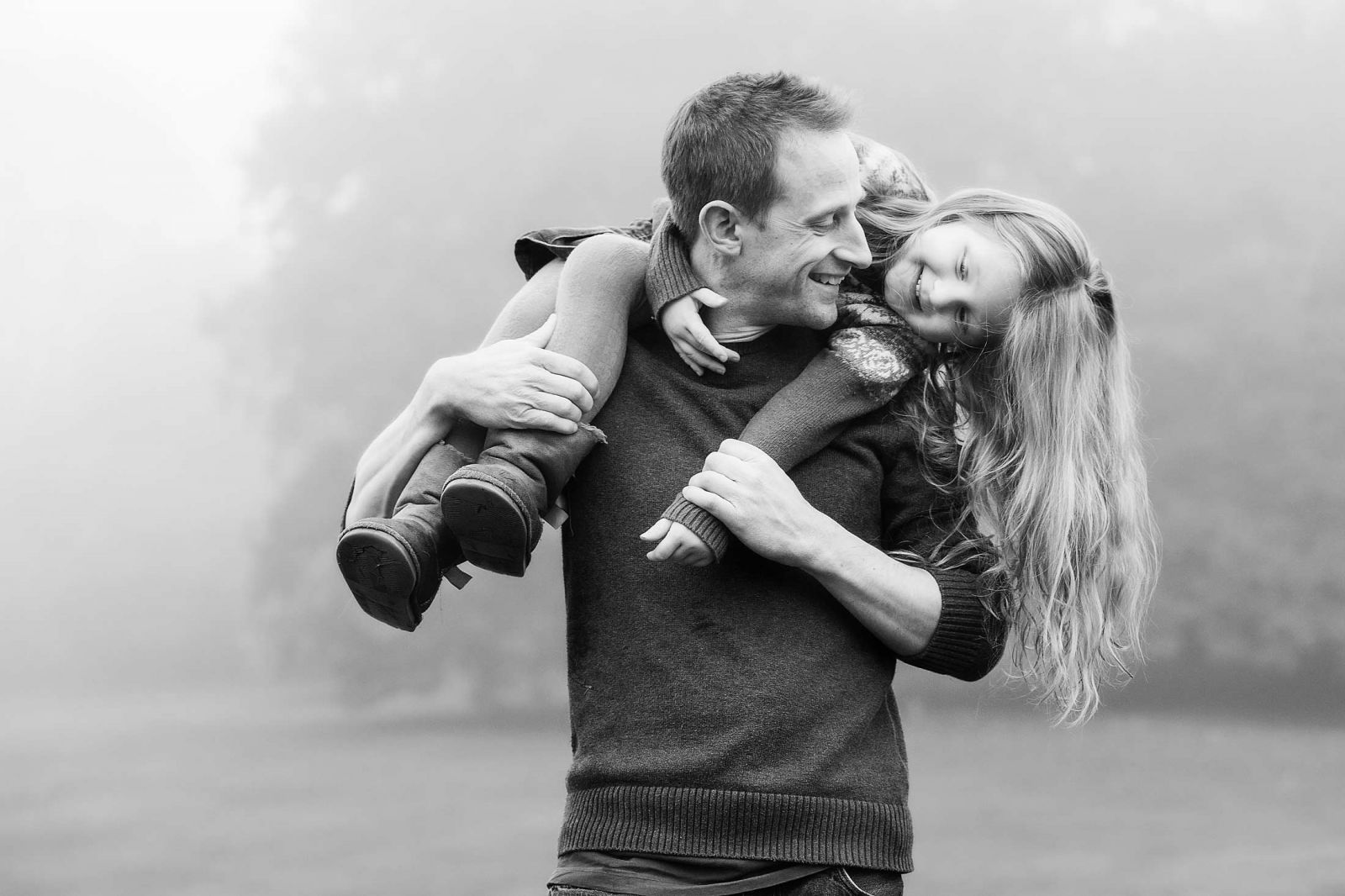 photographer in derby offering child and family portraits; like this shot of a father and daughter having fun together.