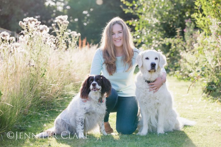 A teenager with her dogs, photographed on a sunny evening in a Derbyshire village