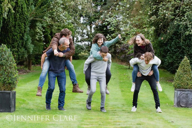 family session in derbyshire, with piggyback fun in the garden